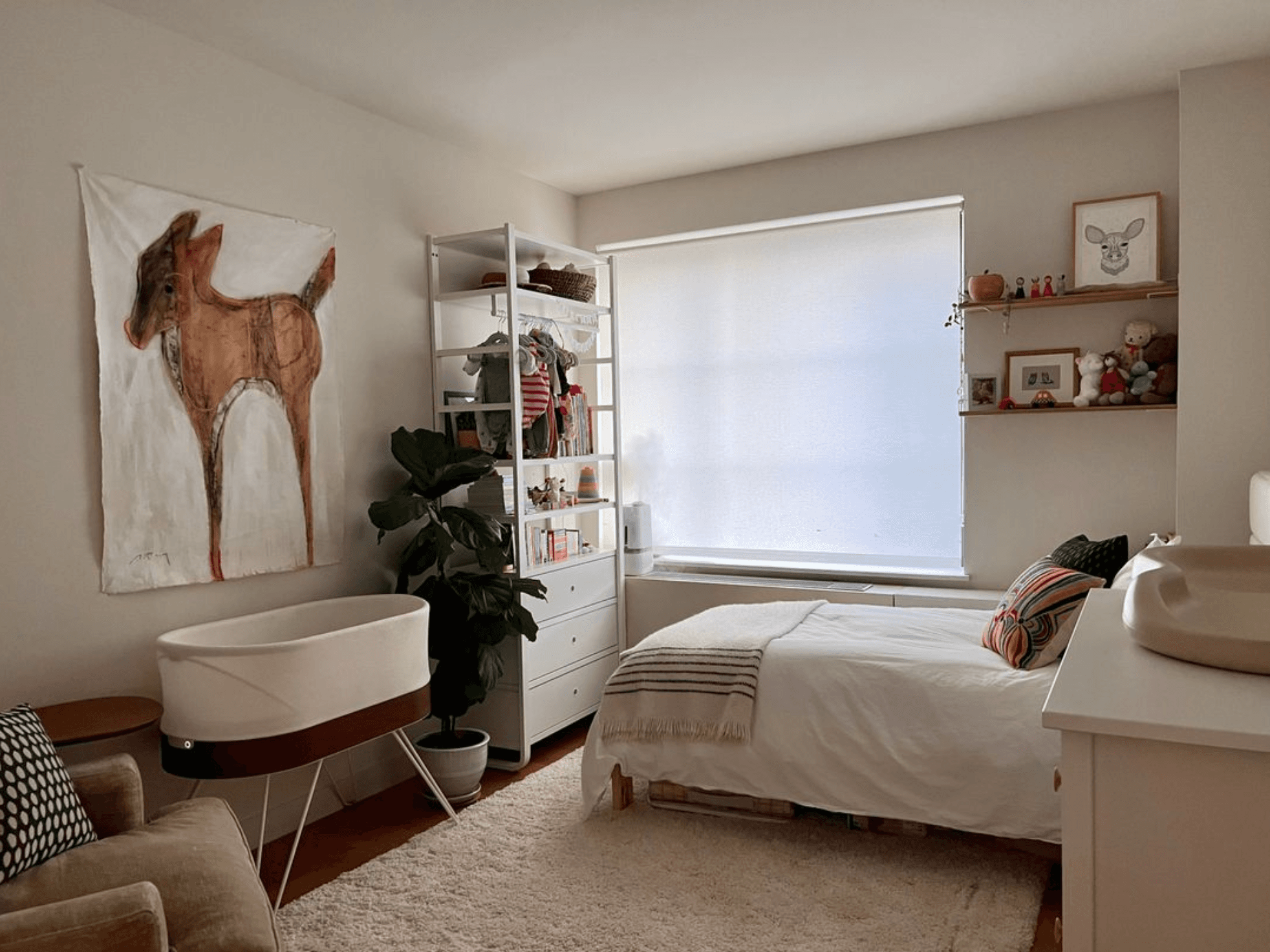 The second bedroom has a mini crib (the Snoo is no longer here!), and a very comfortable twin bed with Parachute linens. 